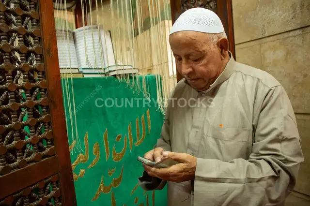 Maqam Caretaker with the Qur’an