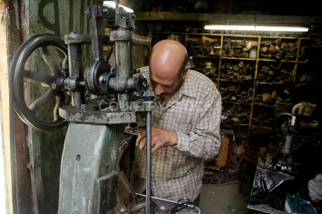Traditional Gazmagy (shoemaker) Crafting and Repairing Shoes in Bulaq Abul-Ela, Cairo