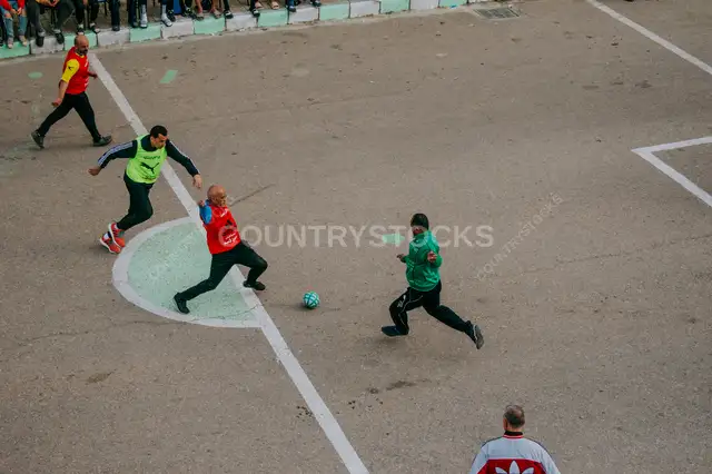 Four Players Challenge for the Ball at Al Falaki Tournament