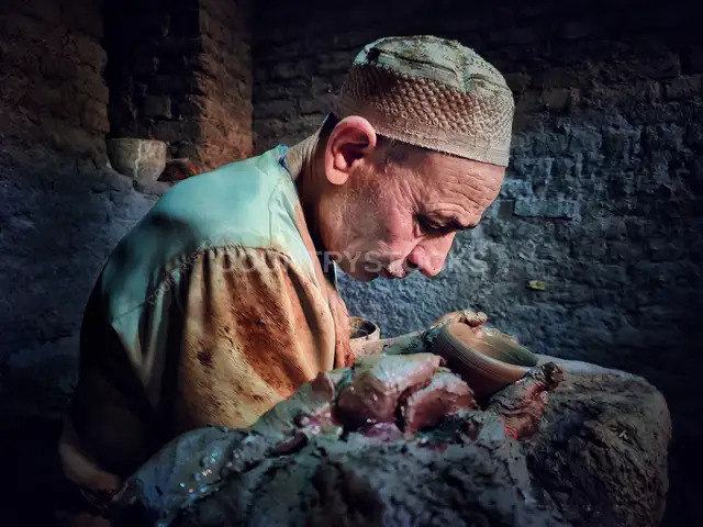 Potter Shaping Clay Vessel Edge, Al-Monofeya Egypt
