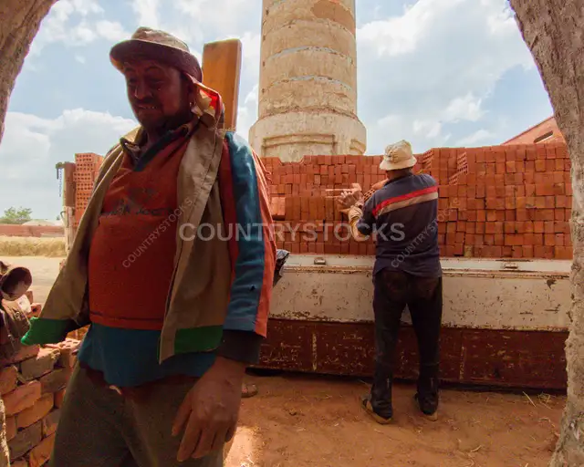 Brick Factory Workers Stacking Red Bricks, Al-Qanater