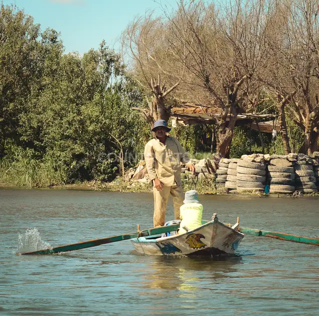 Fisherman on Small Boat, Al-Qanatir Al-Khayriyya