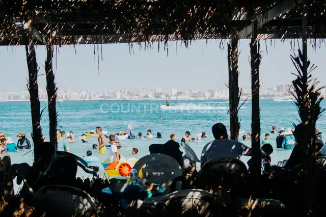Families Swimming at Marsa Matruh Beach, Egypt