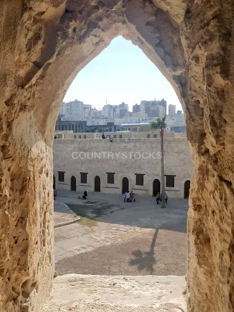Qaitbay Citadel Inner Courtyard Framed Through Stone Arch