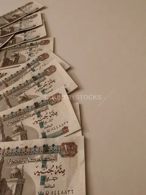 Egyptian 100 Pound Banknotes Fanned on Surface