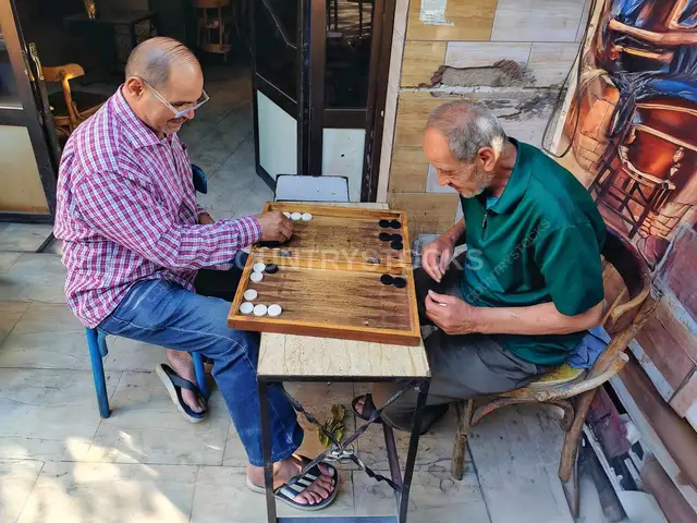 Two Elderly Men Playing Backgammon Outside Cairo Coffeehouse