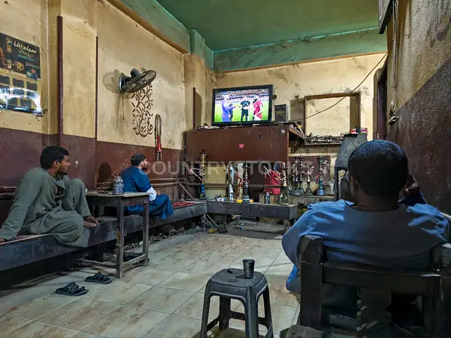 Men Watching Football Match in Traditional Café, Qena
