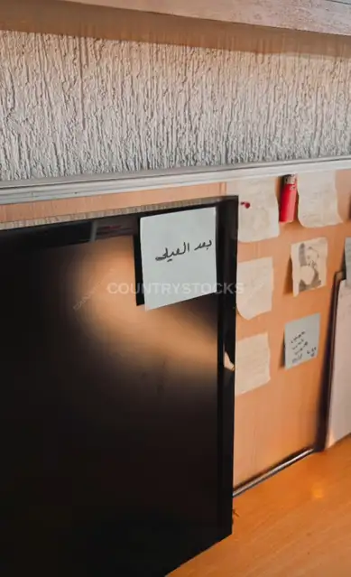 Office Laptop Screen with After Eid Note, Giza