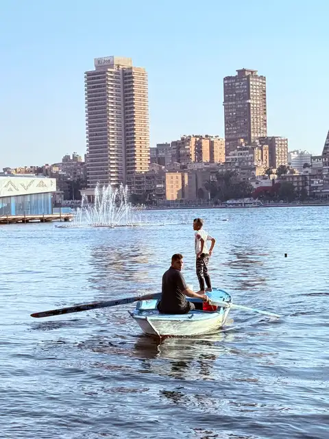 Fisherman and Son on a Boat in the Nile