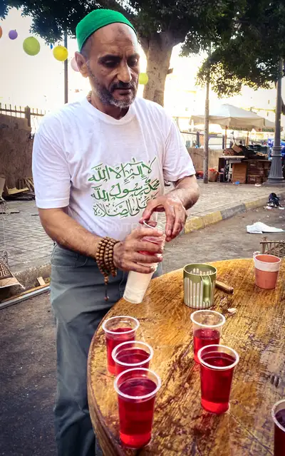 Sharbat Vendor Pouring Festive Drink, Al-Manshiya Alexandria
