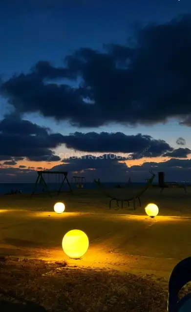 Beach at Night with Globe Lights, Green Beach Village