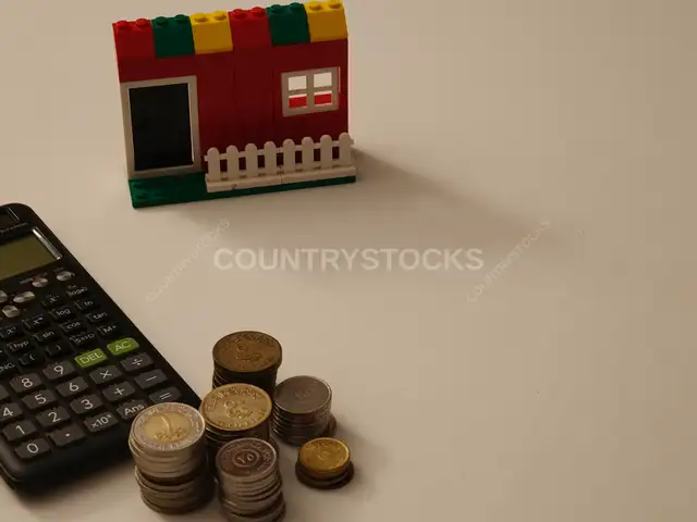 Lego House Coins and Calculator Home Financing Concept