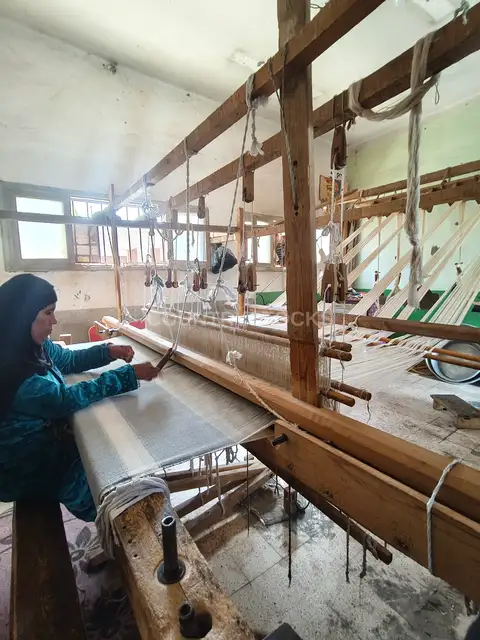 Woman Weaving Textiles on a Traditional Handloom in Sohag, Egypt