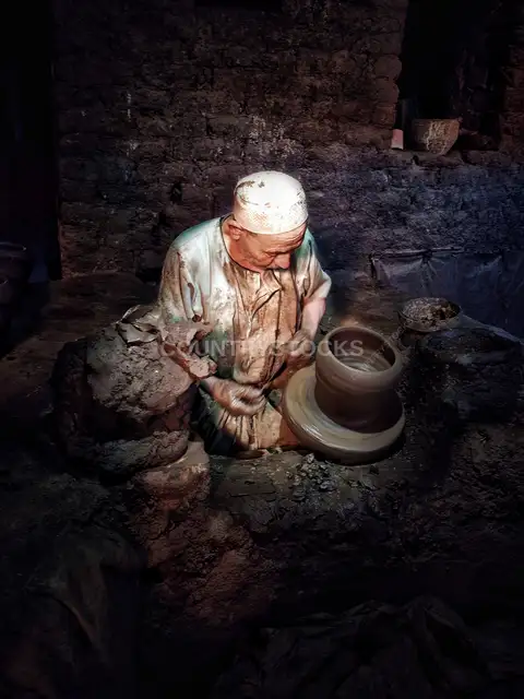 Elderly Potter Shaping Clay on Pottery Wheel, Al-Monofeya