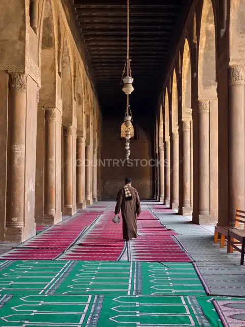 Man Walking Inside Ibn Tulun Mosque Cairo