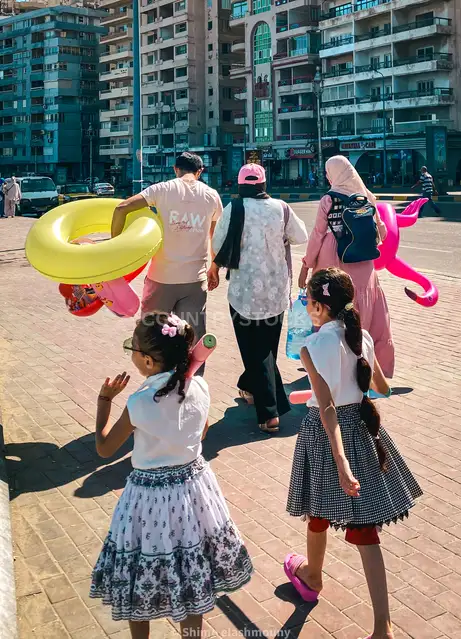 Family Heading to Beach with Inflatables, Alexandria