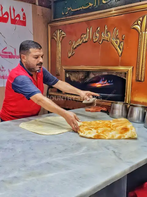 Baker Pulling Hot Feteer From Wood Oven, Al-Hussein Cairo