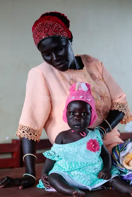 Ugandan Mother and Baby Indoors
