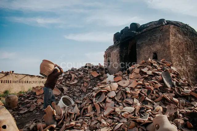 Potter Carrying Clay Vessel at Kiln, Kom Oshim Fayoum