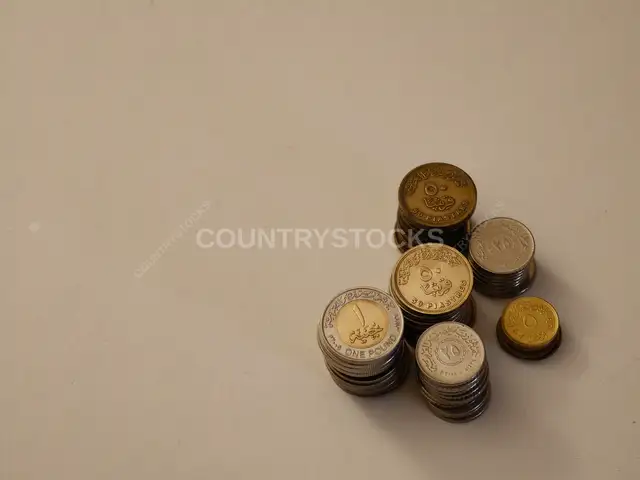 Egyptian Pound Coins Stacked on White Surface