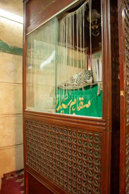 Glass-Enclosed Maqam Interior with Arabic Calligraphy on Al-Ashraf Street in Cairo 2017