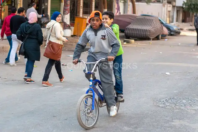 Two Boys Sharing Bicycle on Sudan Street Cairo