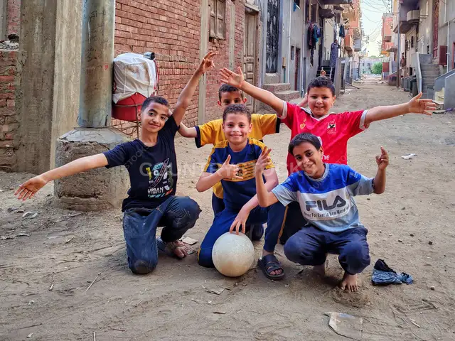 Boys Football Team with Ball, Village Street Al-Monofeya