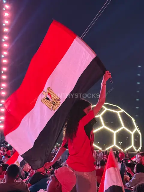 Egyptian Fan Waving Flag at Football Fan Zone Night