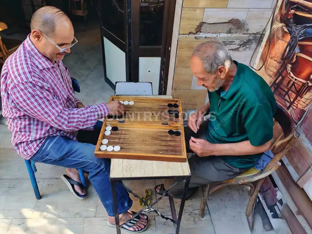 Two Men Playing Backgammon Outside Cairo Ahwa