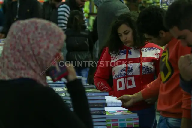 Visitors Browsing Book Stall at Cairo International Book Fair 2017