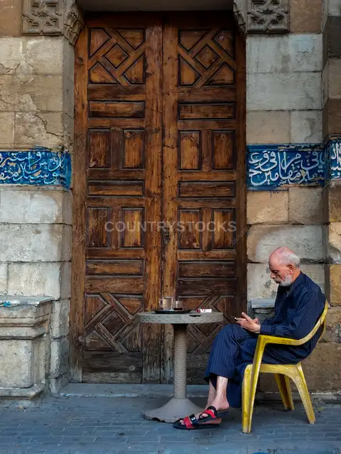 Man at Café Chair, Sayyida Sakina Mosque Gate, Cairo