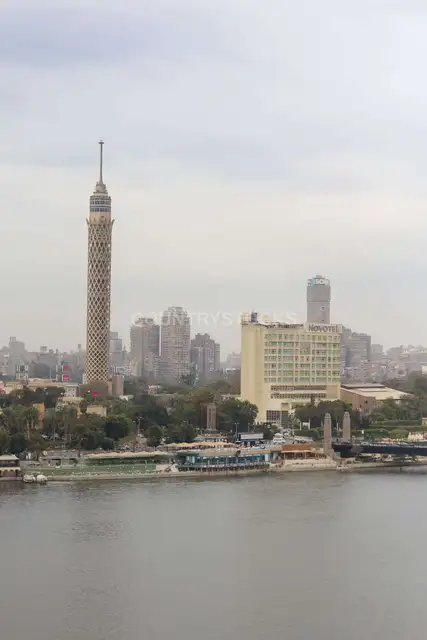 Nile River with Cairo Tower and Riverside Buildings on a Cloudy Day 2