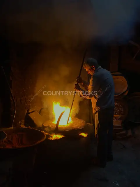 Traditional Craftsman Working Beside a Furnace