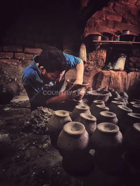 Potter Hand-Shaping Clay Vessel, Al-Monofeya Workshop