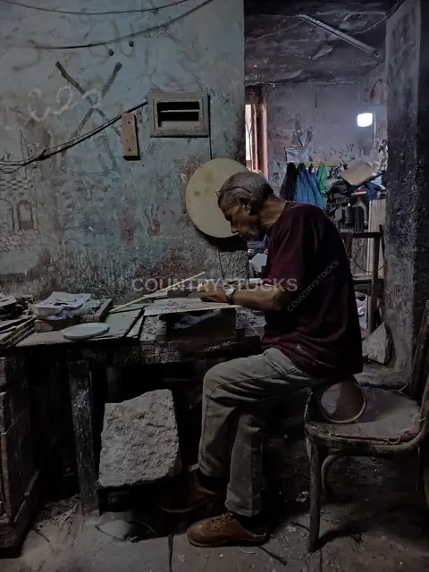 Egyptian Drum Maker Crafting a Traditional Tabla Frame