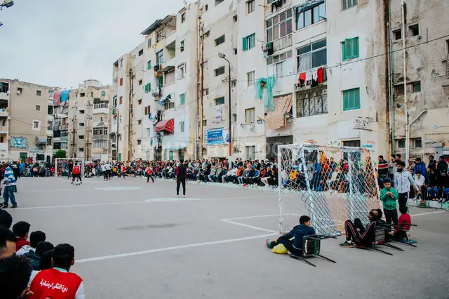 Street Football and Community Crowds at Al-Falaki Tournament in Alexandria