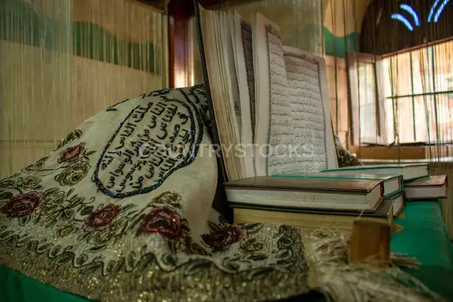 Open Quran on Embroidered Cloth
