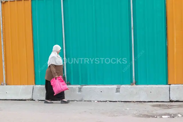Egyptian Woman Walking Cairo Street Carrying Pink Bag