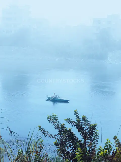 Man Rowing Boat on Nile River, Samannud Egypt