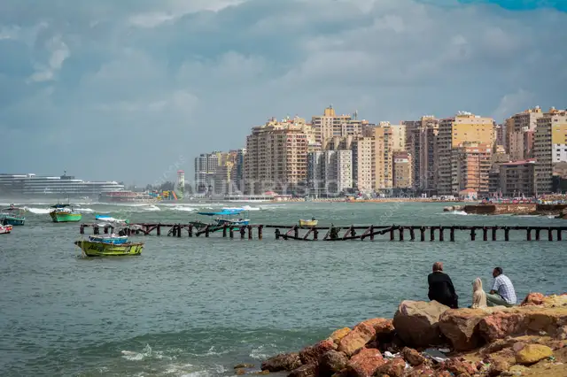 People Sitting on Rocky Shore, Alexandria Waterfront
