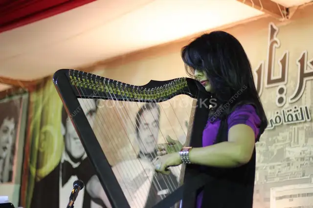 Female Musician Playing the Harp at a Ramadan Tent Event – Egypt 2