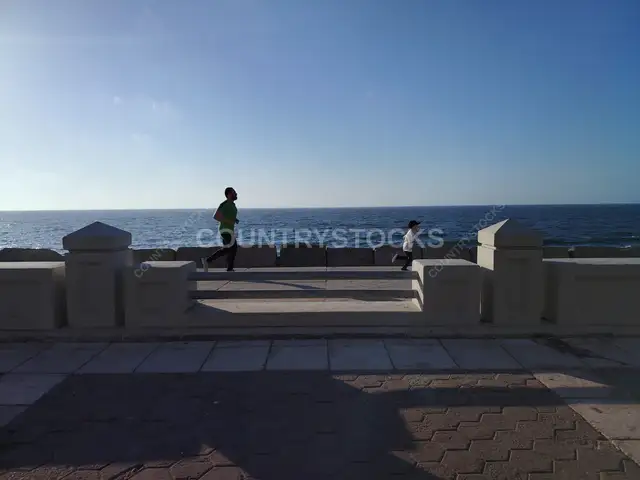 Father and Child Racing on Alexandria Corniche