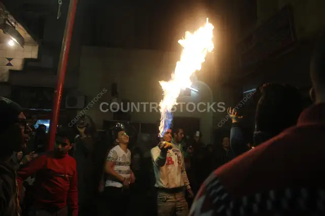 Young Men Performing Fire and Aerosol Spray Dance at Al-Hussein Mawlid – Cairo, Egypt 2