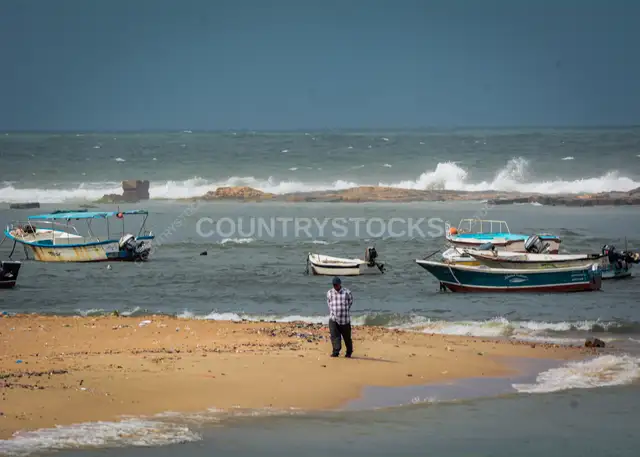 Fisherman on Alexandria Shore with Moored Boats