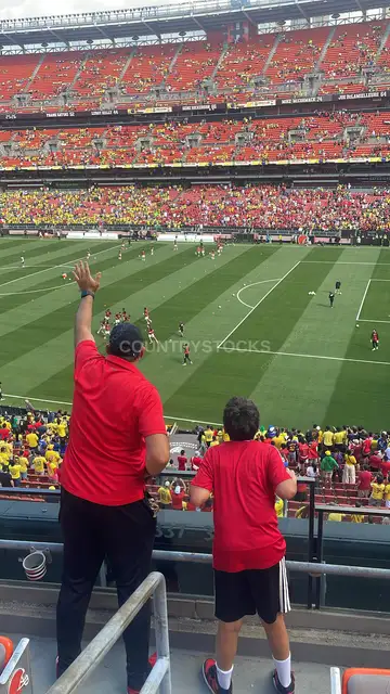 Father and Son Supporting Egypt at World Cup Stadium