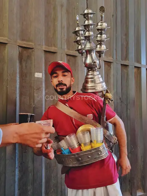 Traditional Erqsous Street Vendor with Brass Dispenser, Cairo