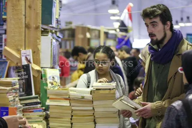 Browsing Books at Cairo International Book Fair 2017 Indoor Crowd Scene