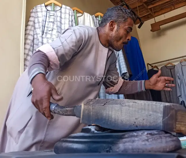 Traditional Foot Iron Clothes Pressing, Esna Luxor