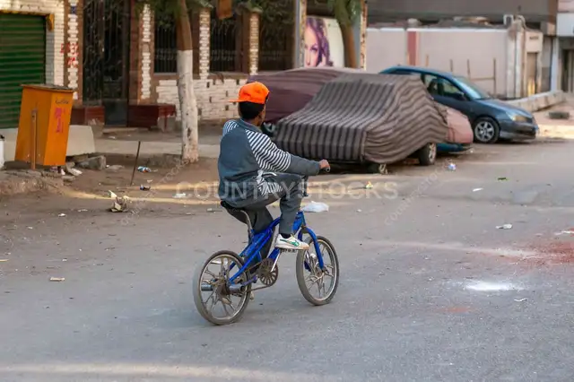 Boy Riding Blue Bicycle, Sudan Street, Cairo