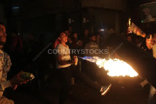Young Men Performing Fire and Aerosol Spray Dance at Al-Hussein Mawlid – Cairo, Egypt 3